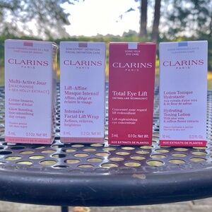 Clarins 4 Pc Travel Sz Skincare NEW